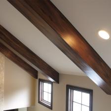 Faux wood ceiling beams custom wall color and plaster fireplace wall